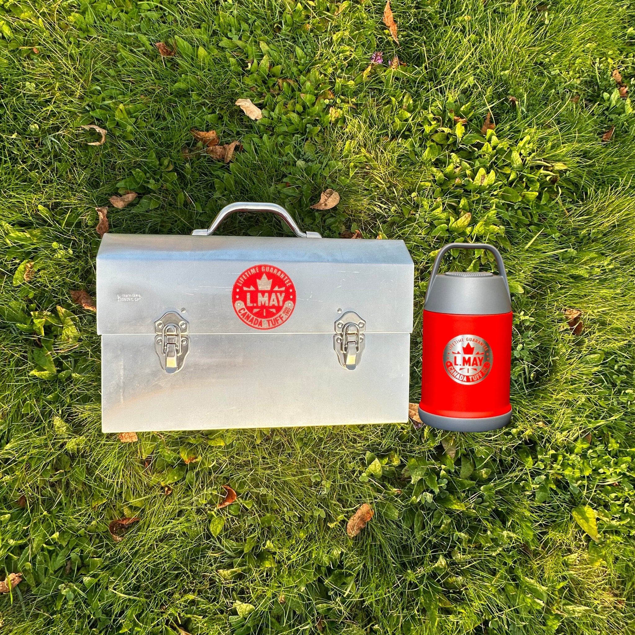 Lifestyle image of an individual carrying the L. May lunchbox and Chilly Moose drinkware, embodying the spirit of adventure and outdoor enjoyment