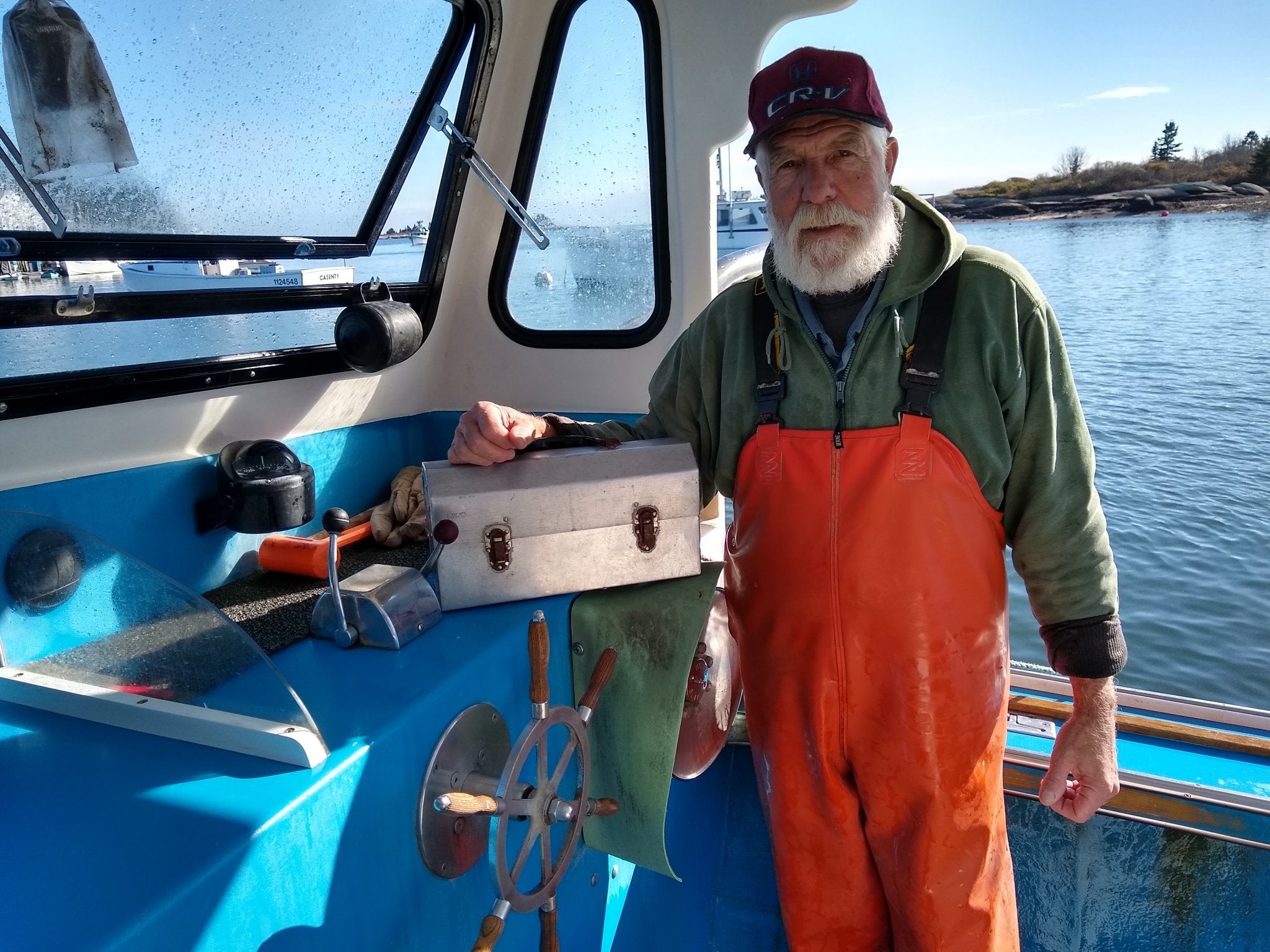 fisherman with an L. May metal lunchbox