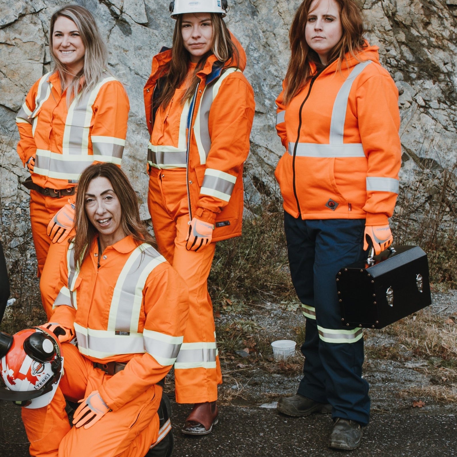 covergalls women workwear holding an L. May lunchbox