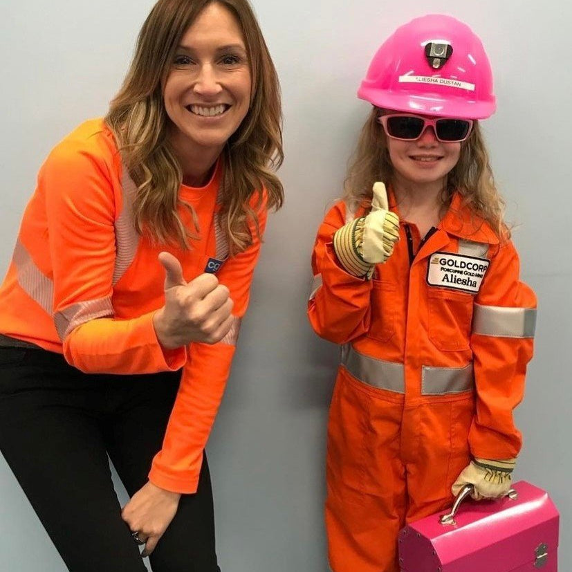 alicia woods from covergalls with a kids workwear holding an L. May pink lunchbox