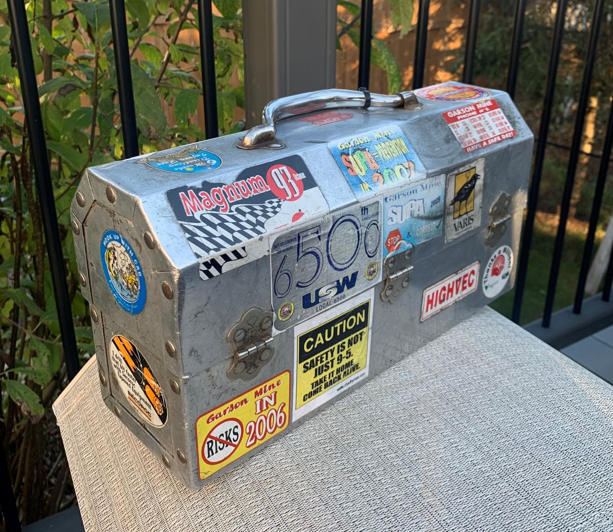 L. May lunchbox of an electrician with stickers