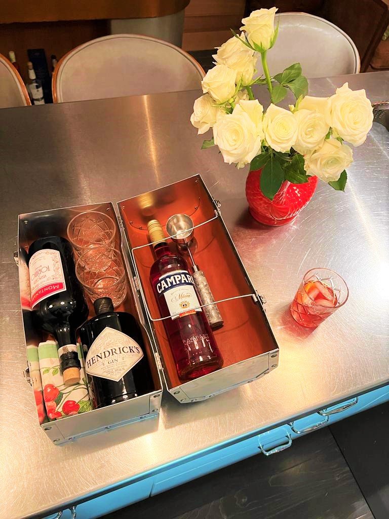 The original 14 L. May lunchbox with bottles of wines as a housewarming gift