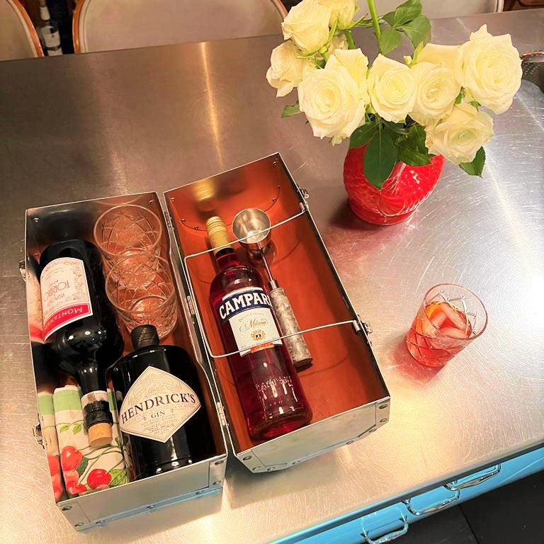 The original 14 L. May lunchbox with bottles of wines as a housewarming gift