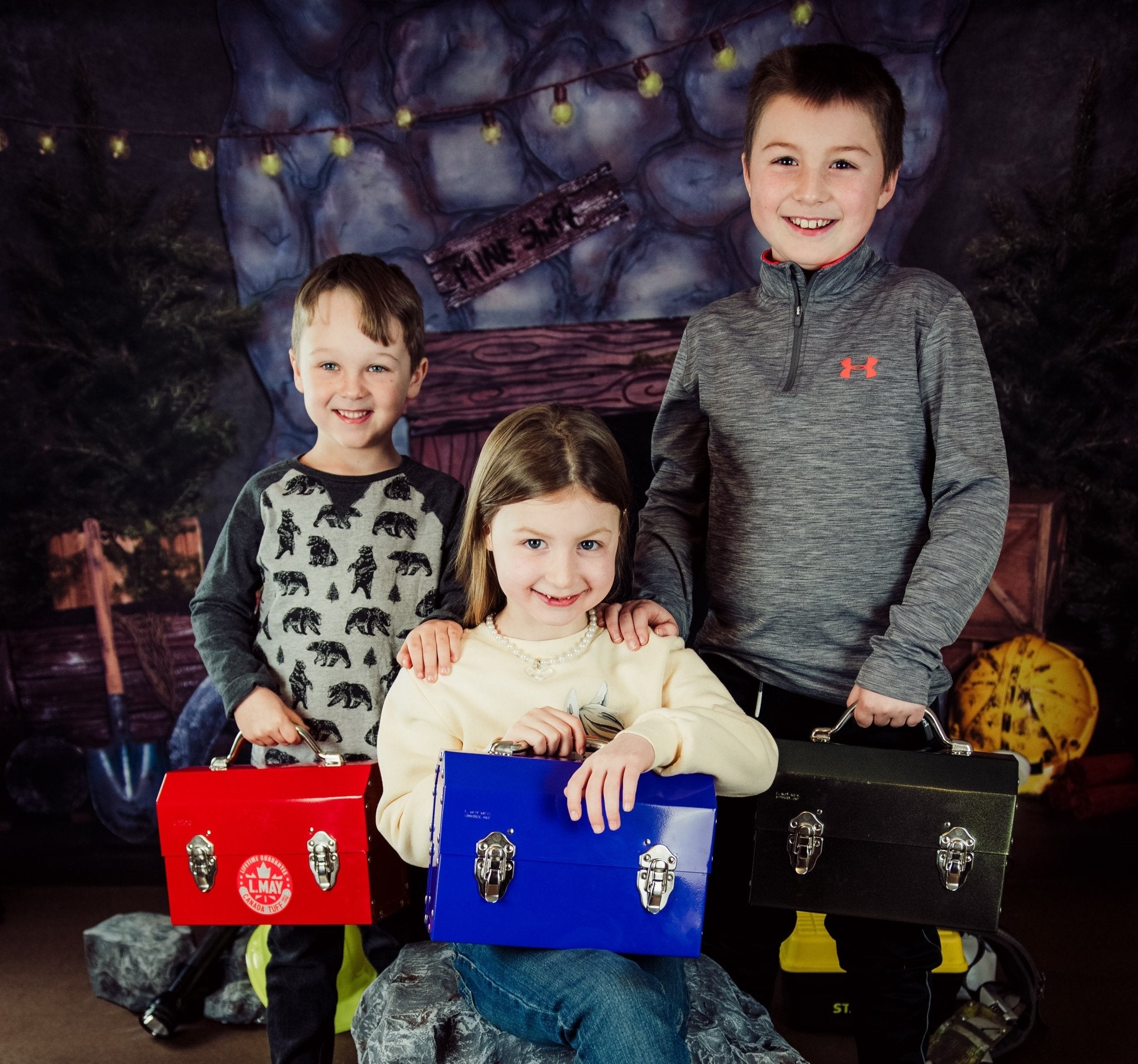 kids in a miner photoshoot campaign carrying an L. May metal lunchbox powder coated in purple, red and bronze 